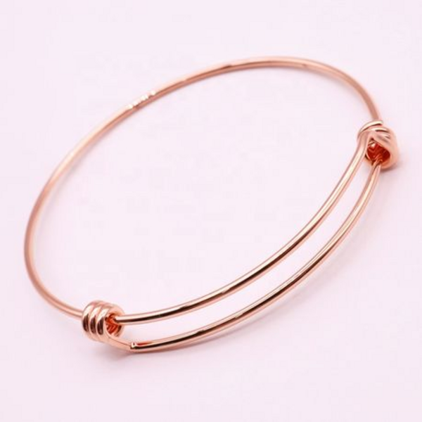 Radiate Elegance with Our Rosy Glow Stainless Steel Rose Gold Bangles